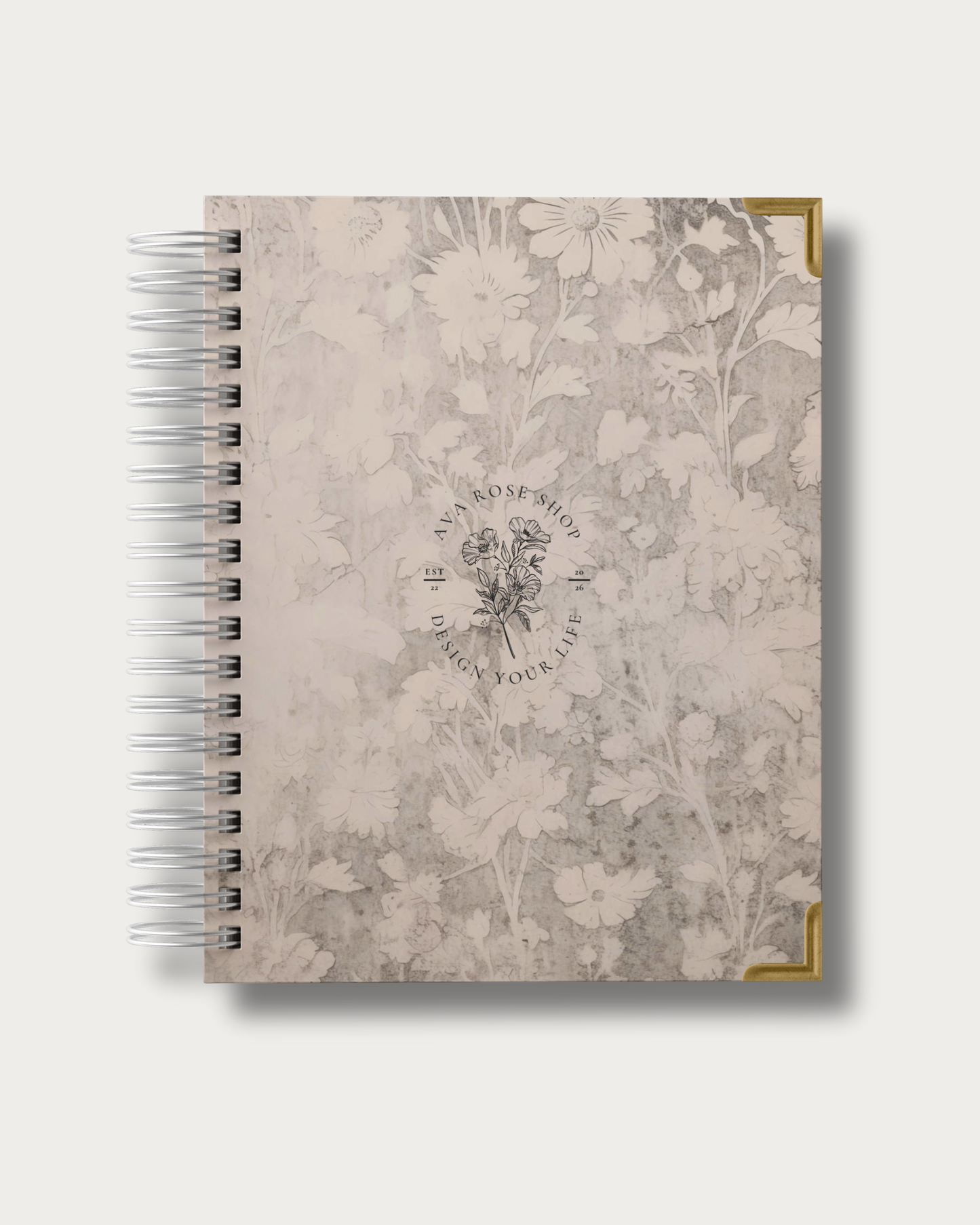Floral patterned planner with a spiral binding on a white background
