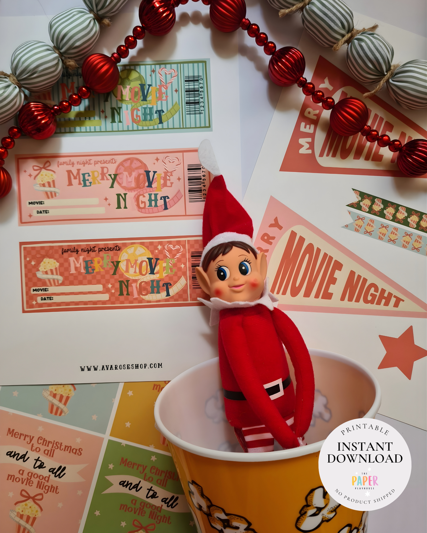 Elf on the Shelf in a movie-themed setting with 'Merry Movie Night' decorations.
